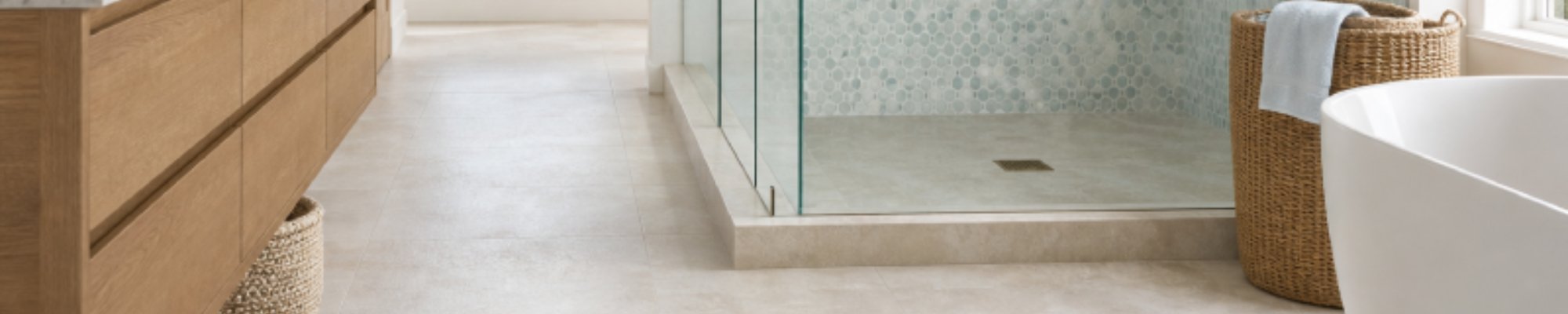 Bathroom remodel with ceramic floors and glass tile shower enclosure